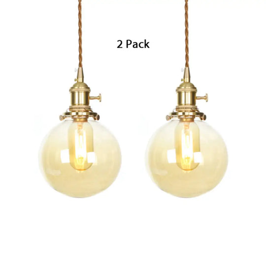 1-Light Amber Pendant Light With Adjustable Cord And Globe Glass Shade - Industrial Indoor Lighting