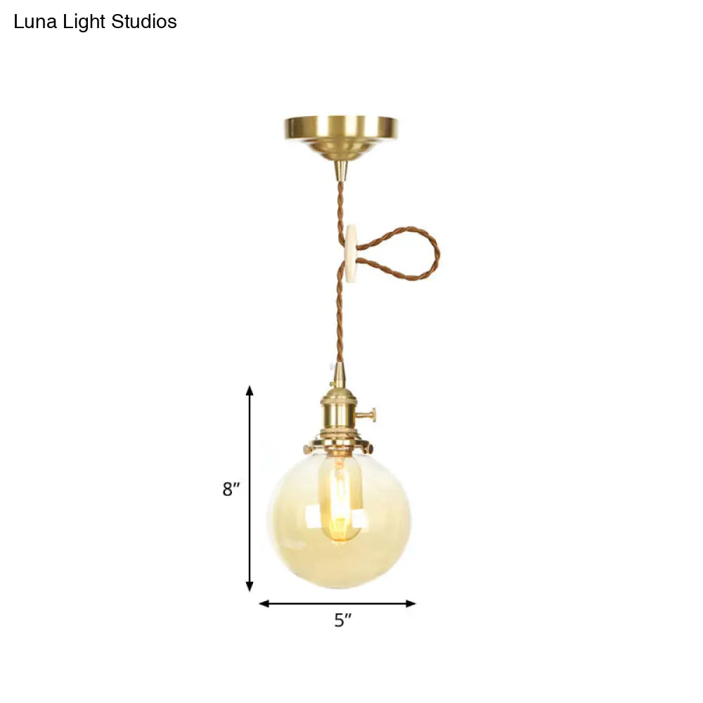 Amber Pendant Light With Adjustable Cord And Globe Glass Shade - Industrial Indoor Lighting