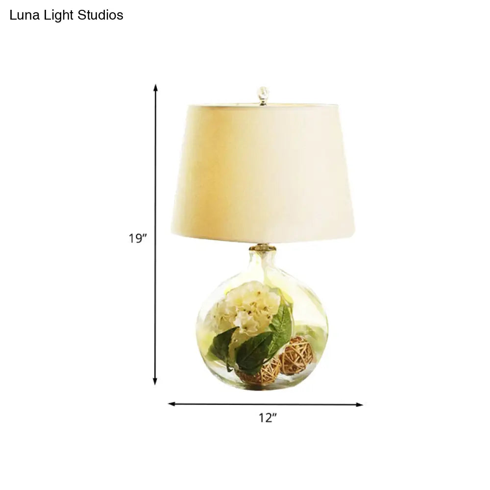 1-Light Fabric White Nightstand Lamp With Industrial Tapered Design And Floral Rattan Ball Decor