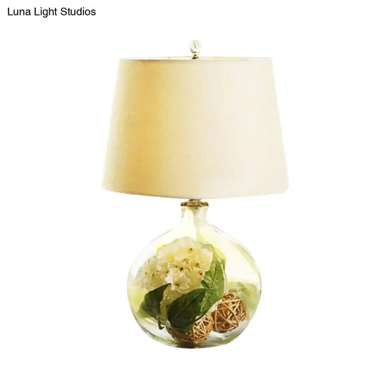 1-Light Fabric White Nightstand Lamp With Industrial Tapered Design And Floral Rattan Ball Decor