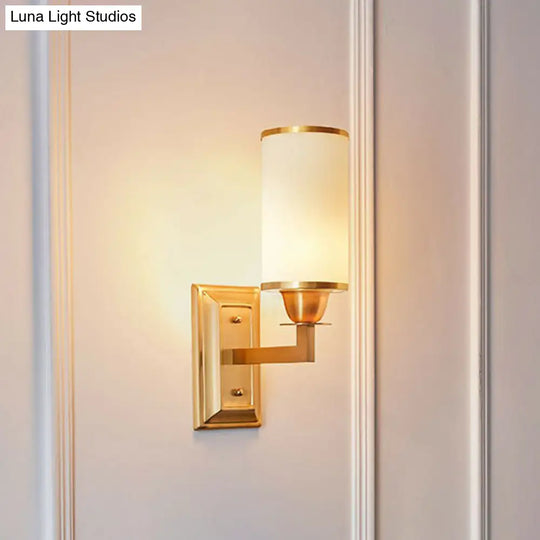 1-Light White Glass Wall Sconce In Traditional Brass - Elegant Cylindrical Dining Room Light