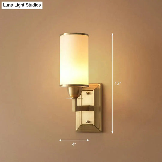 1-Light White Glass Wall Sconce In Traditional Brass - Elegant Cylindrical Dining Room Light