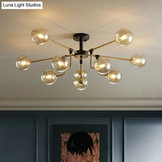 Modern Radial Chandelier With 10 Lights Black And Brass Finish Glass Ball Shades Amber