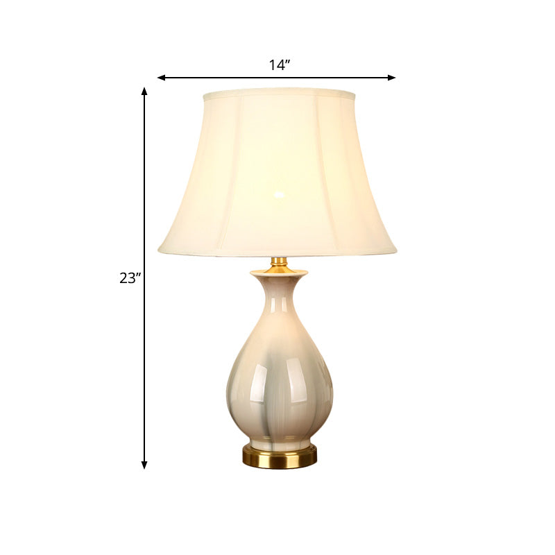 White Conic Design Desk Lamp With Antiqued Style Fabric Shade And Porcelain Vase Base