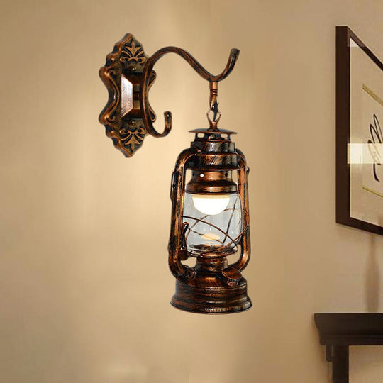 Coastal Living Room Wall Sconce - Clear Glass Light In Bronze Finish