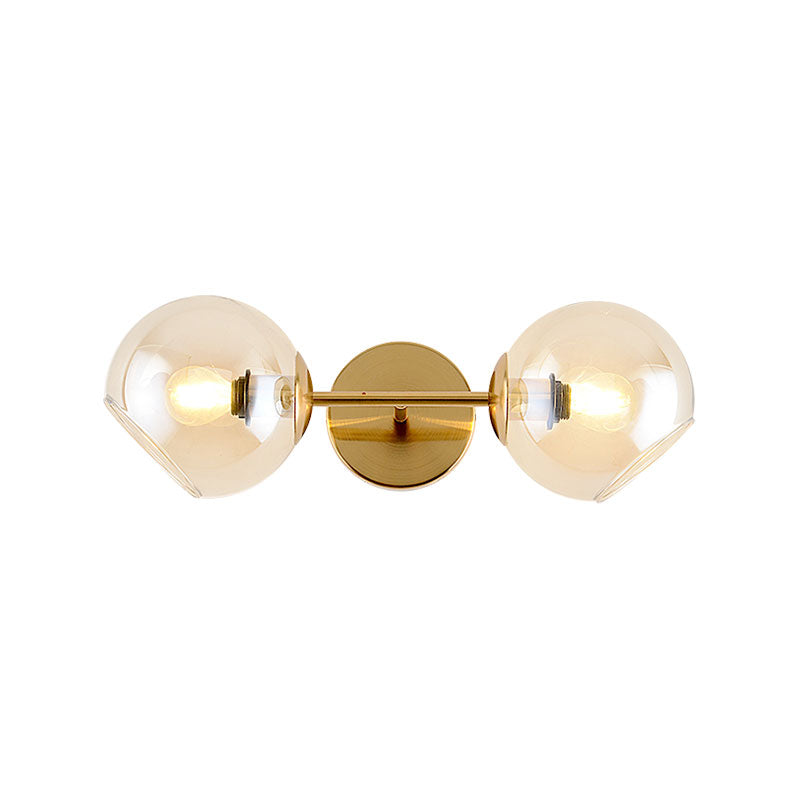 Modernist Gold Wall Lamp With Clear Glass Shade - 2 Lights Spherical Mount Fixture