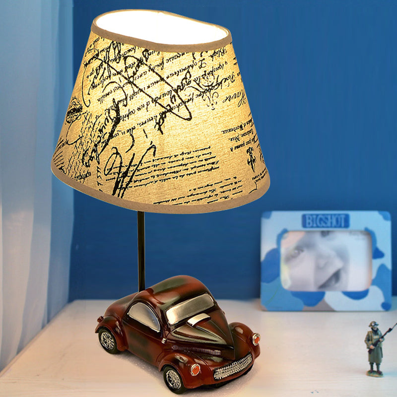 Kids Beige Barrel Night Table Lamp With Car Base - 1-Light Fabric Bedroom Nightstand Light