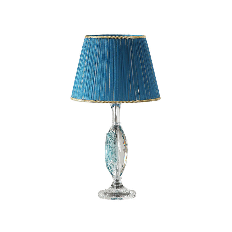 Traditional Clear Crystal Night Light With Blue Fabric Shade And Oblong Base

This Revised Title