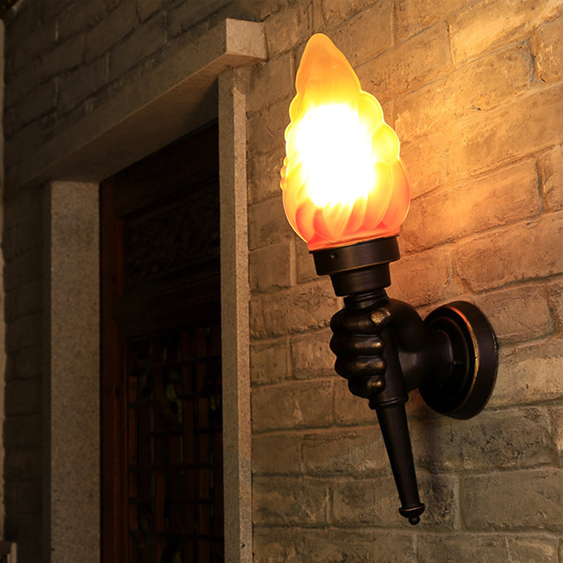 Black Wall Sconce With Amber Glass Torch And Hand Decor - Single Bulb Mount Light