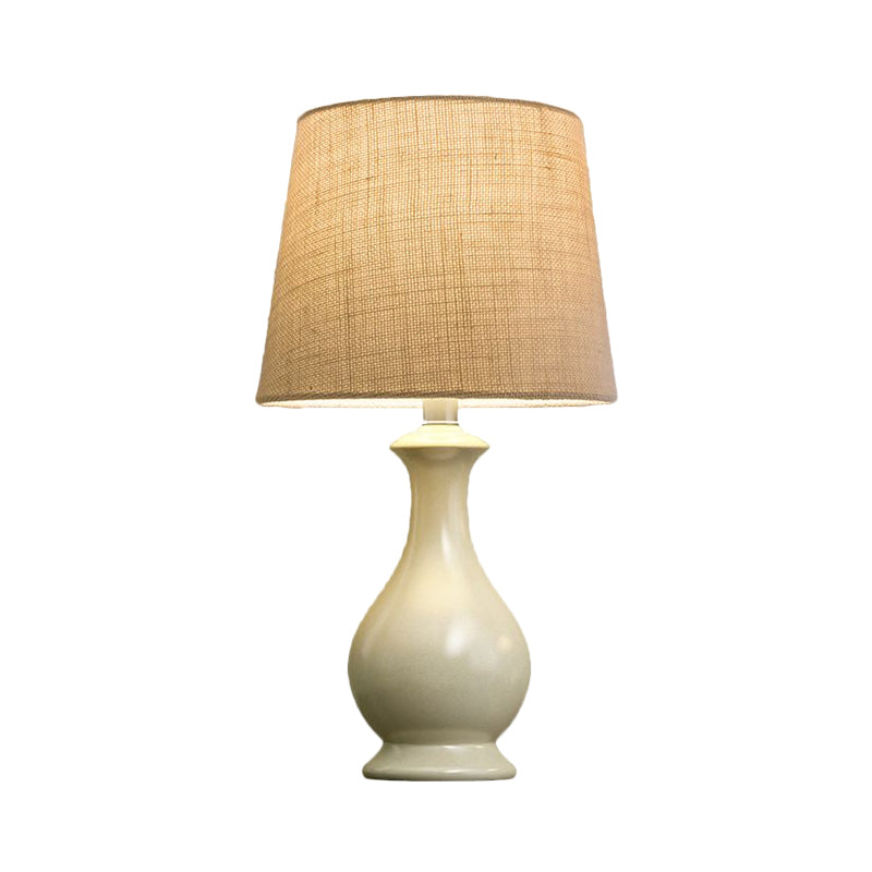 Countryside Beige Fabric Desk Lamp With Conical Bulb And White Vase Base