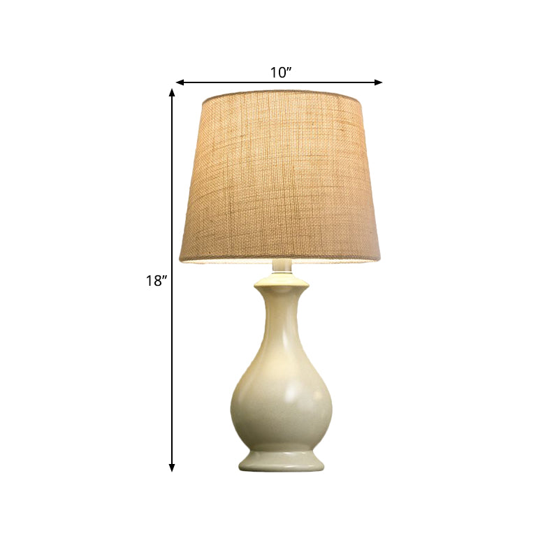 Countryside Beige Fabric Desk Lamp With Conical Bulb And White Vase Base