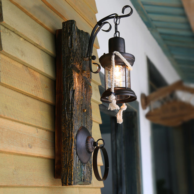 Coastal Black Kerosene Sconce With Clear Glass Bulb And Wooden Backplate For Outdoor Lighting
