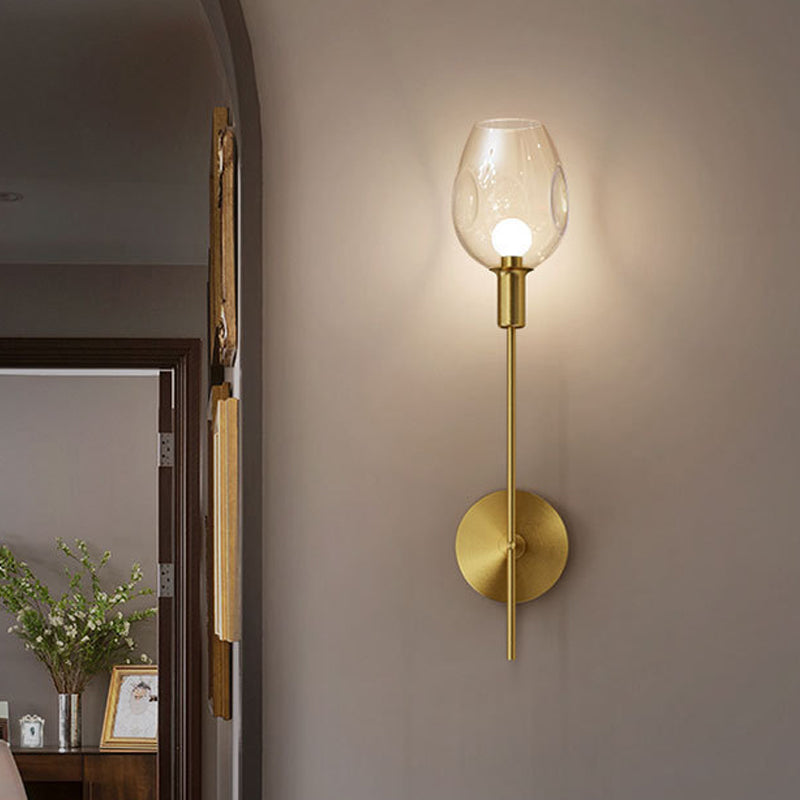 Minimalist Gold Sconce Wall Light With Clear Dimpled Cup And Pencil Arm For Hallway
