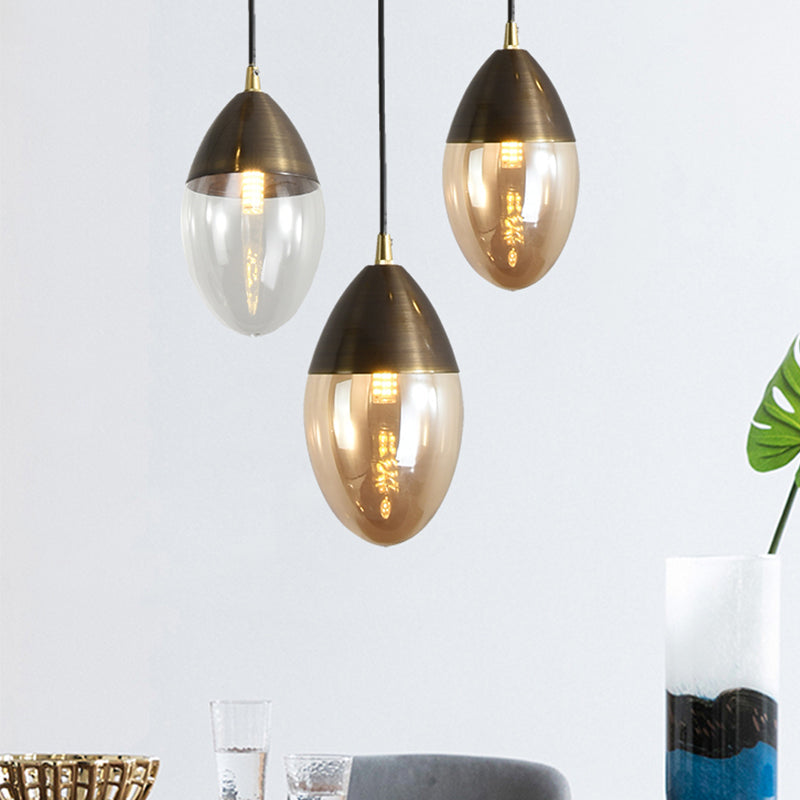 Sleek Postmodern Ellipsoid Pendant Light - Clear/Amber Glass LED, Ideal for Dining Room Ceiling