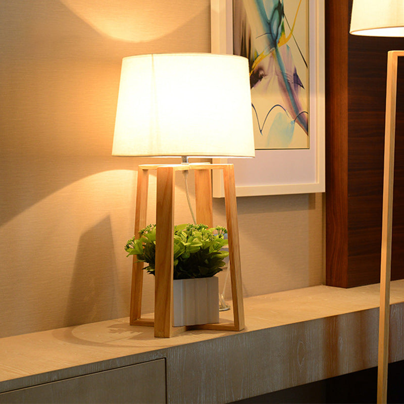 Modern Beige Trapezoid Nightstand Lamp With Wood Base And Tapered Fabric Shade