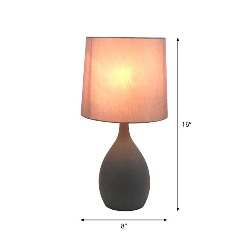 Minimalist Single Grey Metal Night Lamp With Teardrop Shape Cylinder Fabric Shade And Table Stand