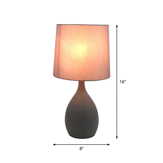 Minimalist Single Grey Metal Night Lamp With Teardrop Shape Cylinder Fabric Shade And Table Stand