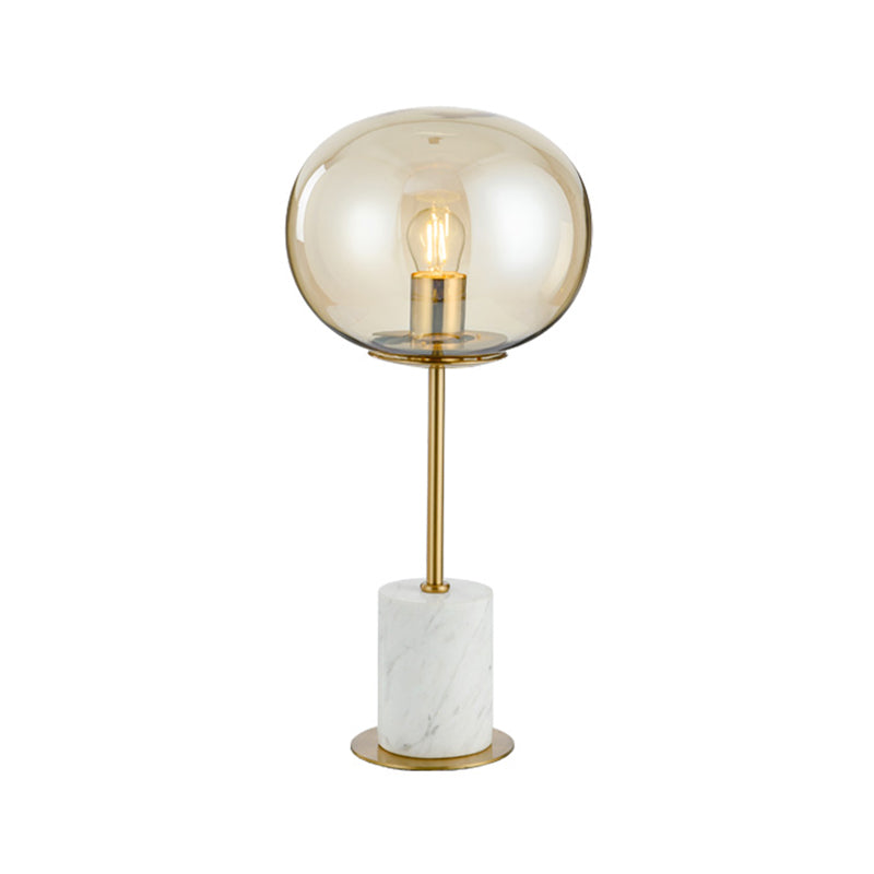 Clear Glass Night Light With Minimalist Oval Design Brass Accents And Marble Base