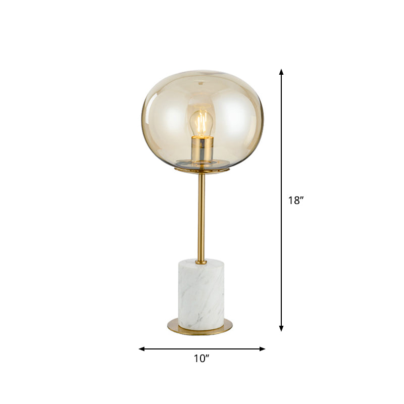 Clear Glass Night Light With Minimalist Oval Design Brass Accents And Marble Base