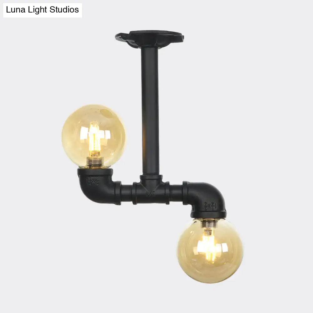 2-Head Semi-Flush Industrial Ball Amber Glass Ceiling Fixture In Black