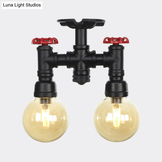 2-Head Semi-Flush Industrial Ball Amber Glass Ceiling Fixture In Black