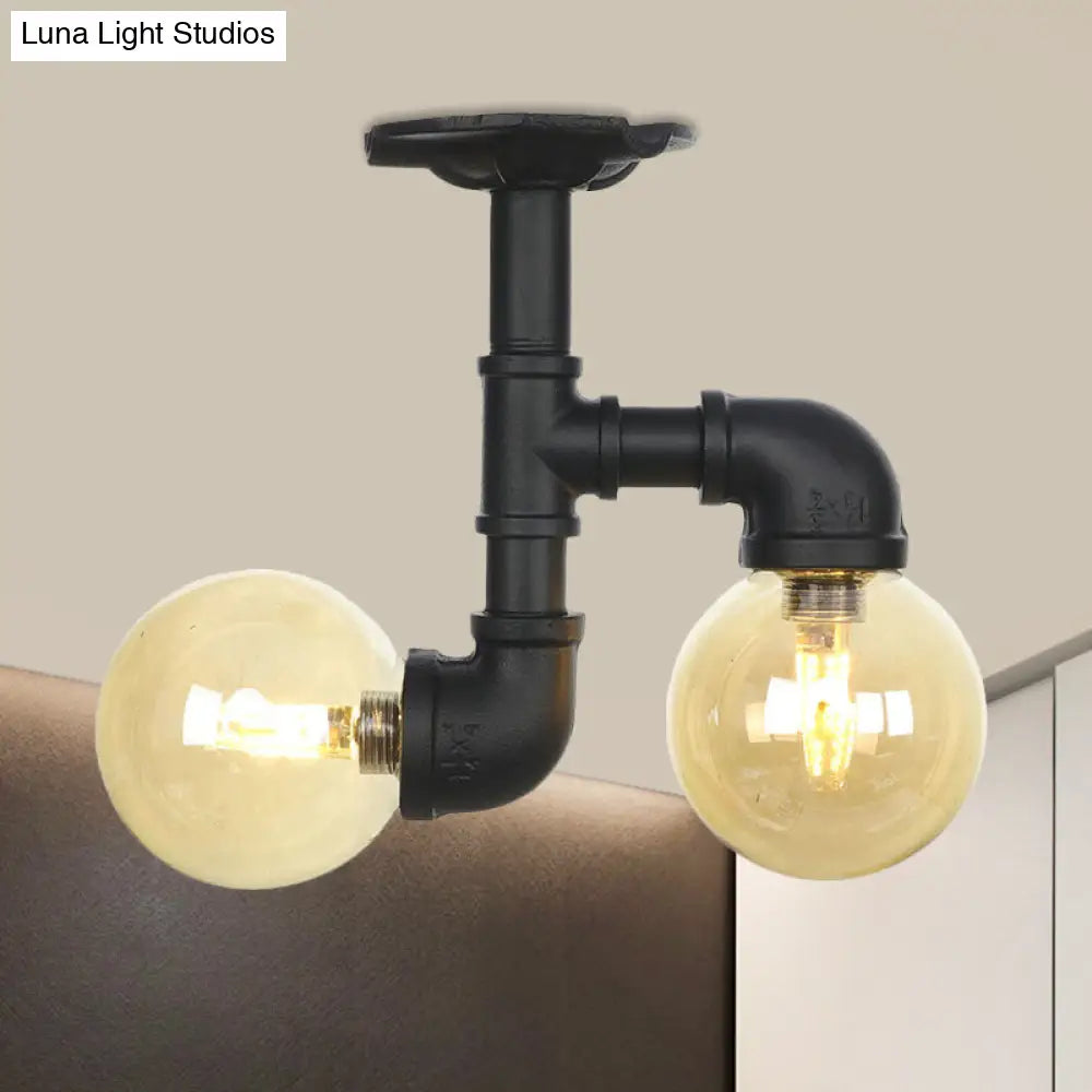 2-Head Semi-Flush Industrial Ball Amber Glass Ceiling Fixture In Black / C