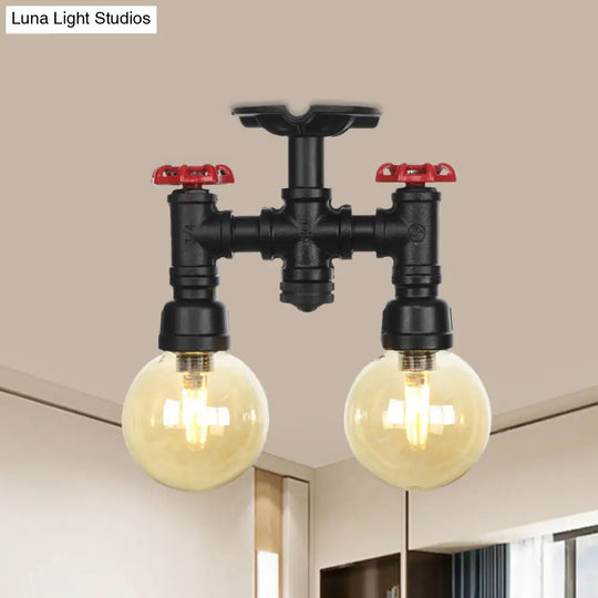 2-Head Semi-Flush Industrial Ball Amber Glass Ceiling Fixture In Black