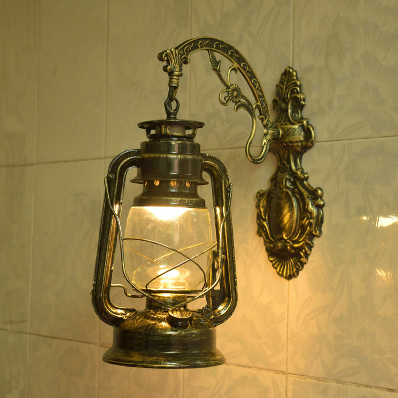 Nautical Clear Glass Kerosene Wall Sconce With Curved Arm For Restaurants Brass / C