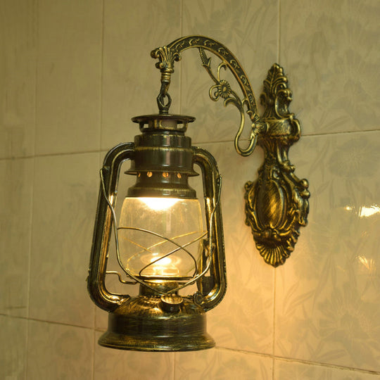Nautical Clear Glass Kerosene Wall Sconce With Curved Arm For Restaurants Brass / C