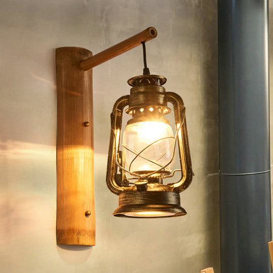 Coastal Lantern 1-Head Wall Light Sconce With Clear Glass And Bamboo Backplate Antique Brass