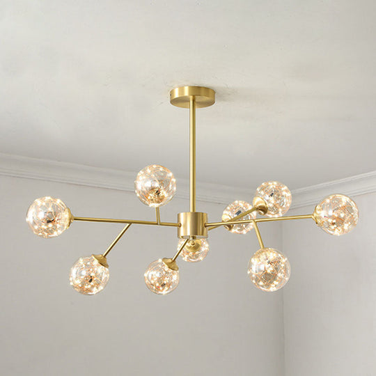 Minimalist Metal LED Chandelier in Gold with Starburst Pendulum Design and Bubble Shade