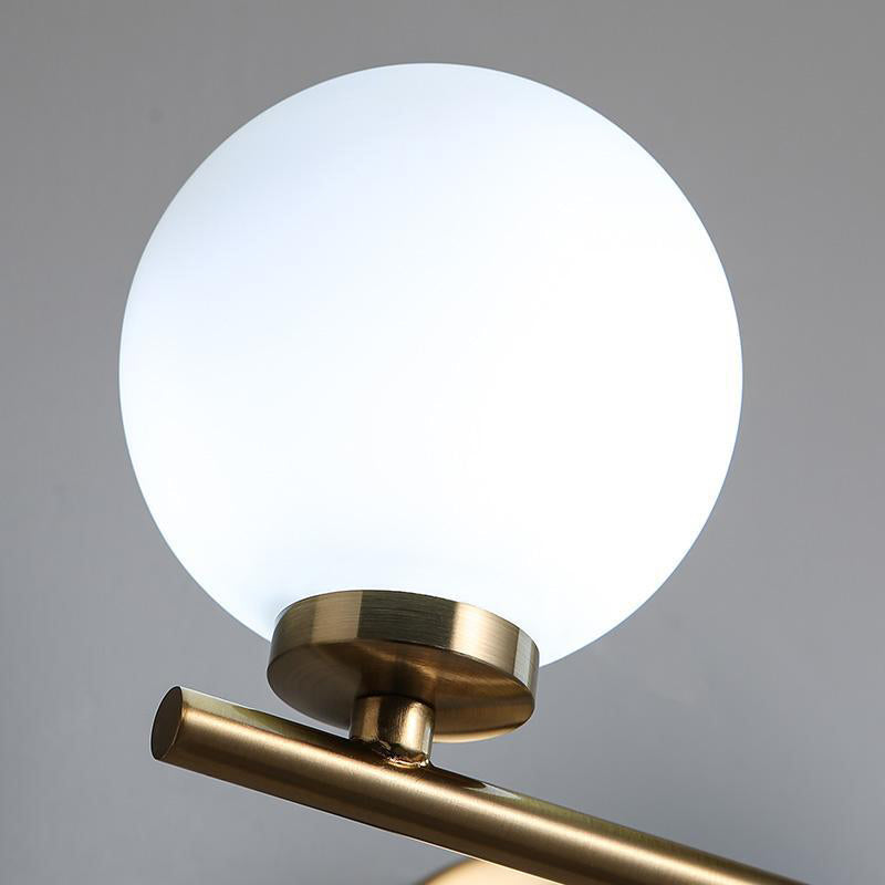 Modern Opal Glass Wall Sconce With Globe Shade And Gold Accent For Washroom Lighting