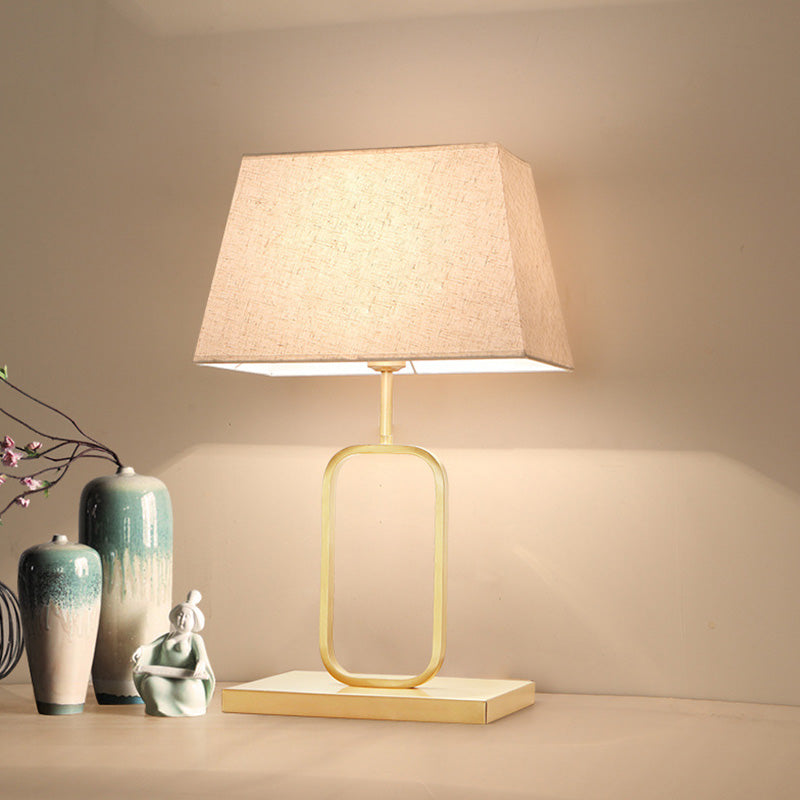 Modern Gold Bedside Table Lamp With Rounded Rectangle Shape And Fabric Shade