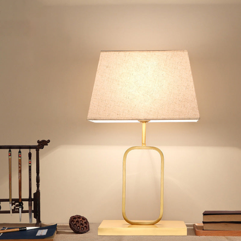Modern Gold Bedside Table Lamp With Rounded Rectangle Shape And Fabric Shade