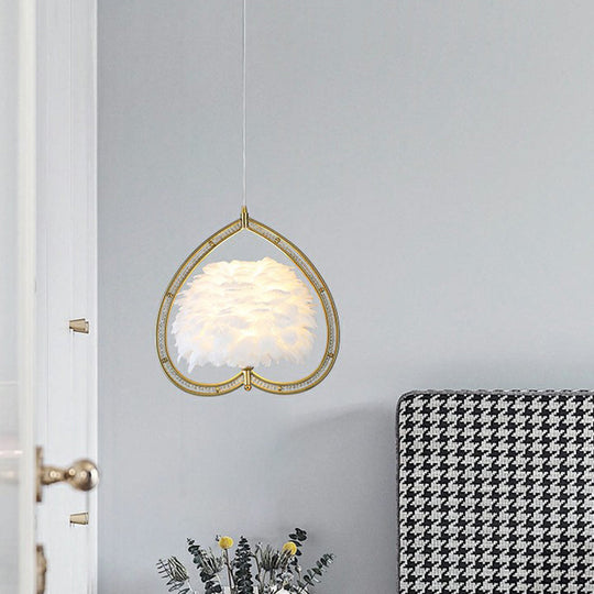 Contemporary Gold Pendant Light With Metallic Heart Suspension And Decorative Feather