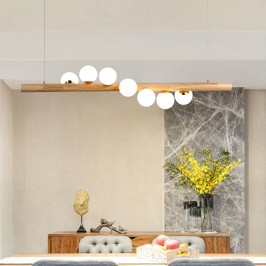 Minimalist Cream Glass Led Pendant Light For Restaurants - Ball Island Ceiling With Wood Accent