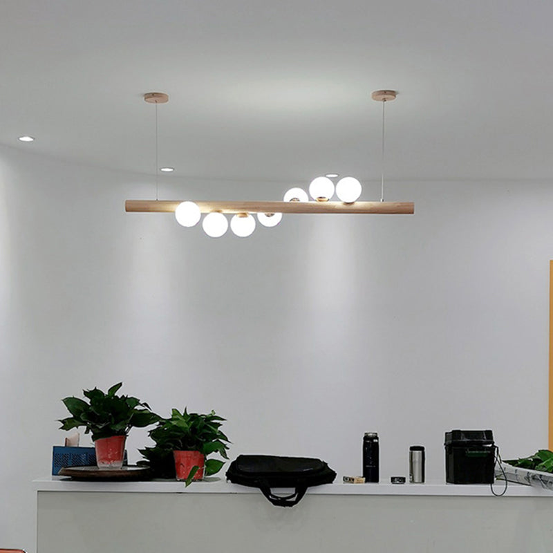 Minimalist Cream Glass Led Pendant Light For Restaurants - Ball Island Ceiling With Wood Accent
