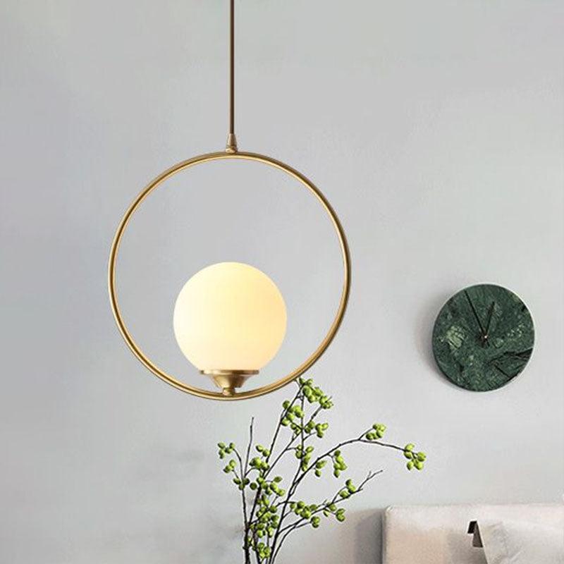 Minimalist Antique Gold Ball Ceiling Lamp with Cream Glass Shade and Ring Decoration