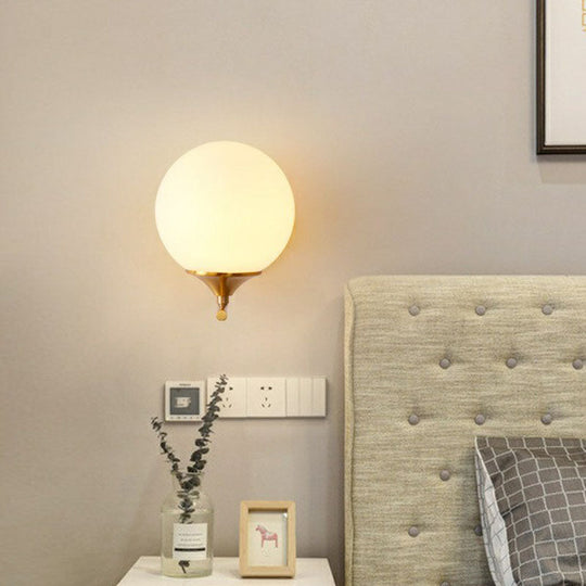 Minimalist Gold Sphere Bedside Wall Sconce - 1-Light Milk Glass Mounted Light With Right Angle Arm