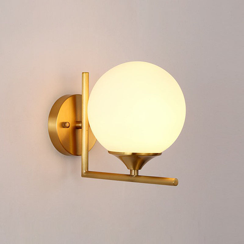 Minimalist Gold Sphere Bedside Wall Sconce - 1-Light Milk Glass Mounted Light With Right Angle Arm /