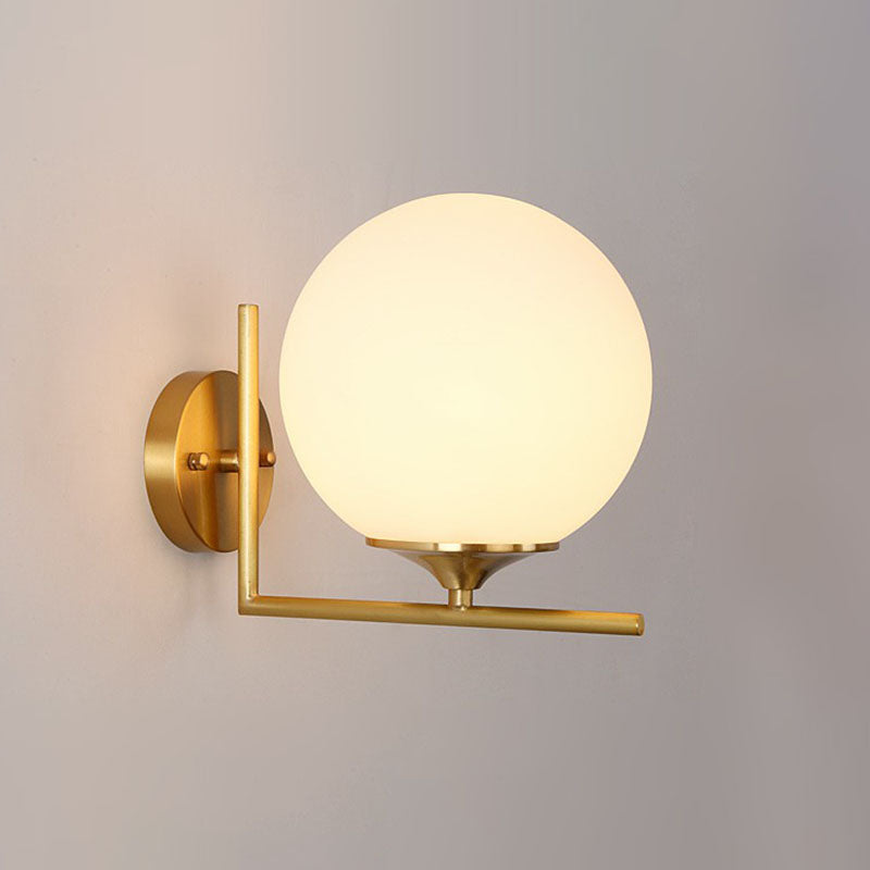 Minimalist Gold Sphere Bedside Wall Sconce - 1-Light Milk Glass Mounted Light With Right Angle Arm /