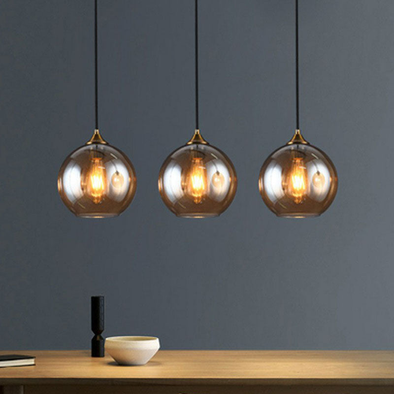 Antiqued Brass Globe Pendant Lamp With Postmodern Design And Glass Shades Amber / Linear