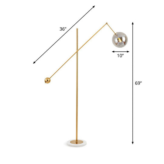 Postmodern Brass Plated Balance Arm Floor Lamp With Glass Spherical Shade - Stylish Metal Stand-Up