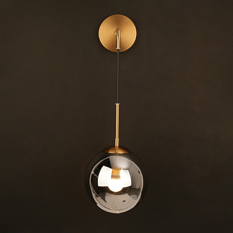 Sleek Silver Glass Ball Wall Hanging Lamp With Brass Mount - Perfect Bedroom Lighting Solution