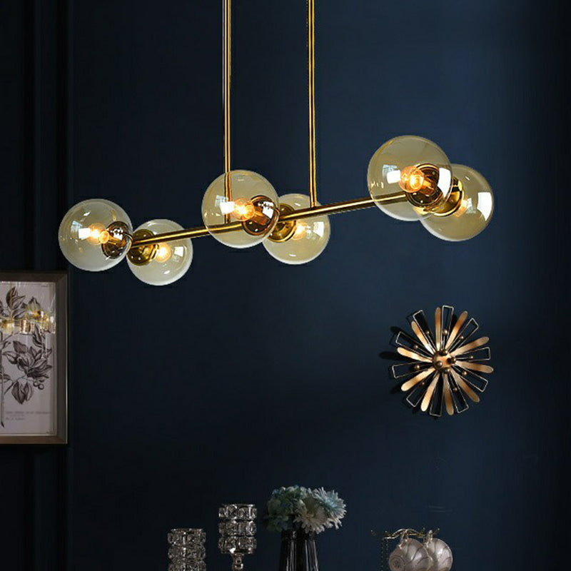 Postmodern Brass Island Light With Globe Glass Shade: Stylish Metal Ceiling Fixture