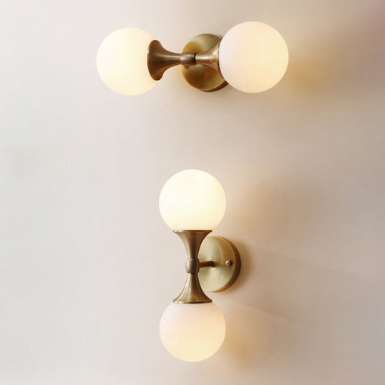 Ivory Glass Ball Wall Lamp With 2-Head Brass Sconce For Bedroom