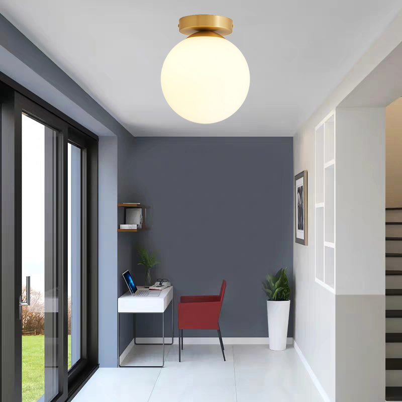 Sleek Minimalist Single Entryway Flush Mount Ceiling Light With Gold Accent & White Glass