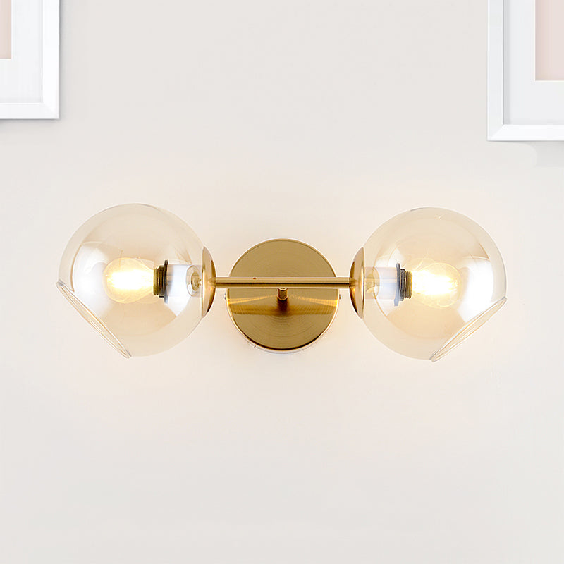 Modernist Gold Wall Lamp With Clear Glass Shade - 2 Lights Spherical Mount Fixture