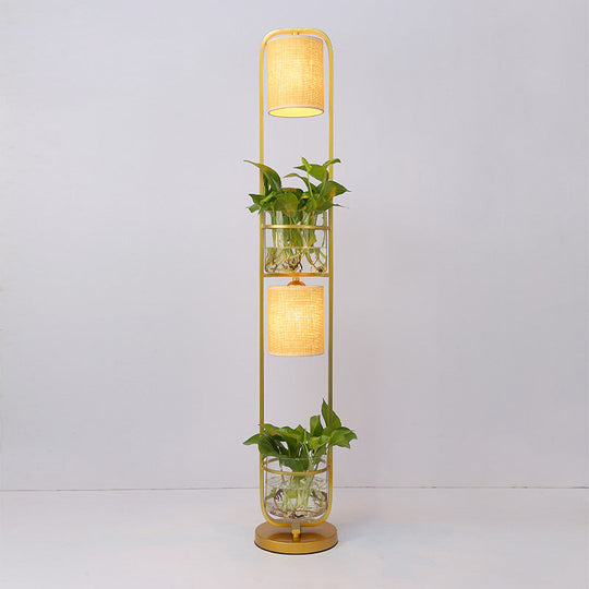 Modern 2-Headed Cylindrical Fabric Floor Lamp With Glass Plant Jar Gold