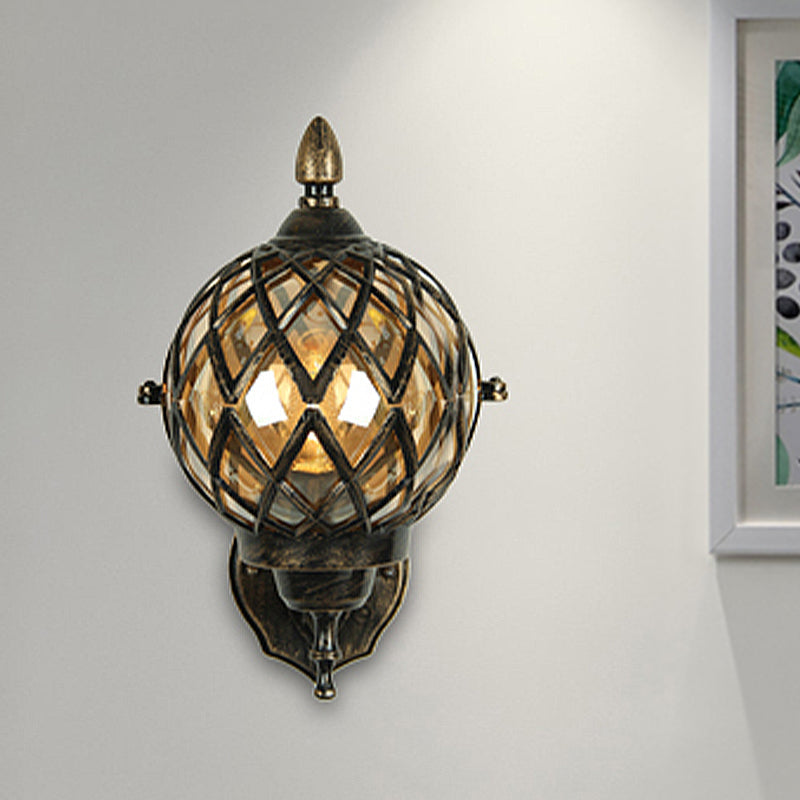 Amber Glass Wall Sconce With Industrial Cage And Black Globe For Dining Room Lighting